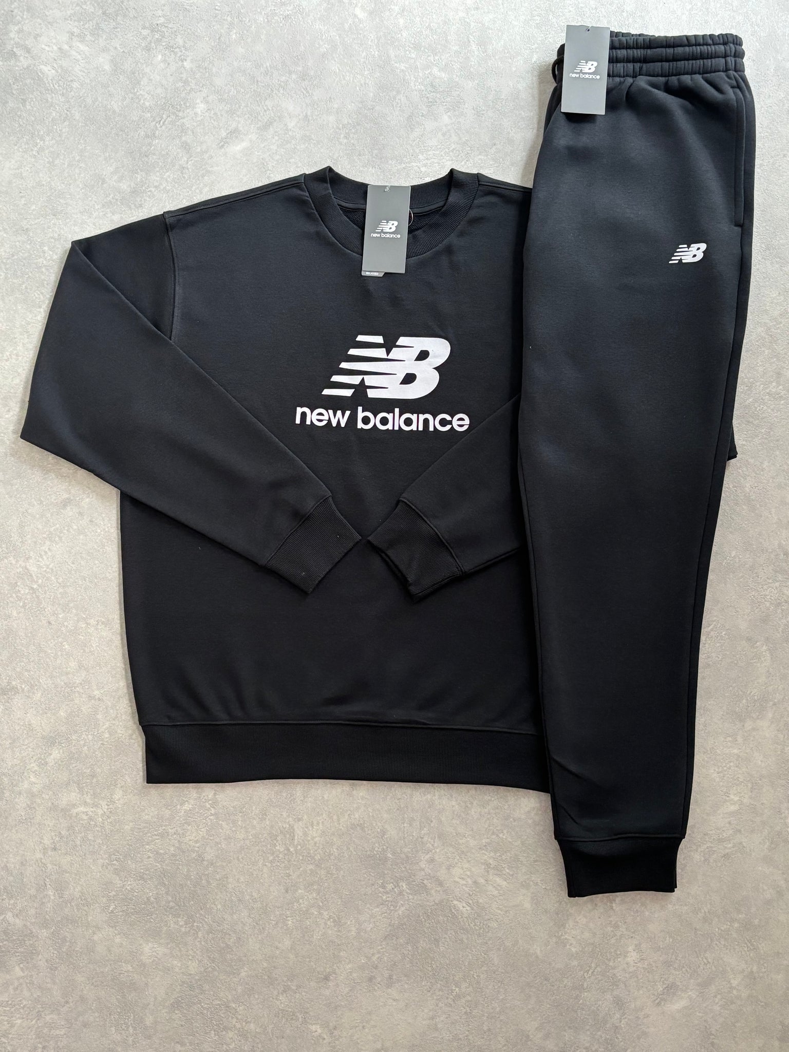 New Balance Fleece Trainingspak Zwart
