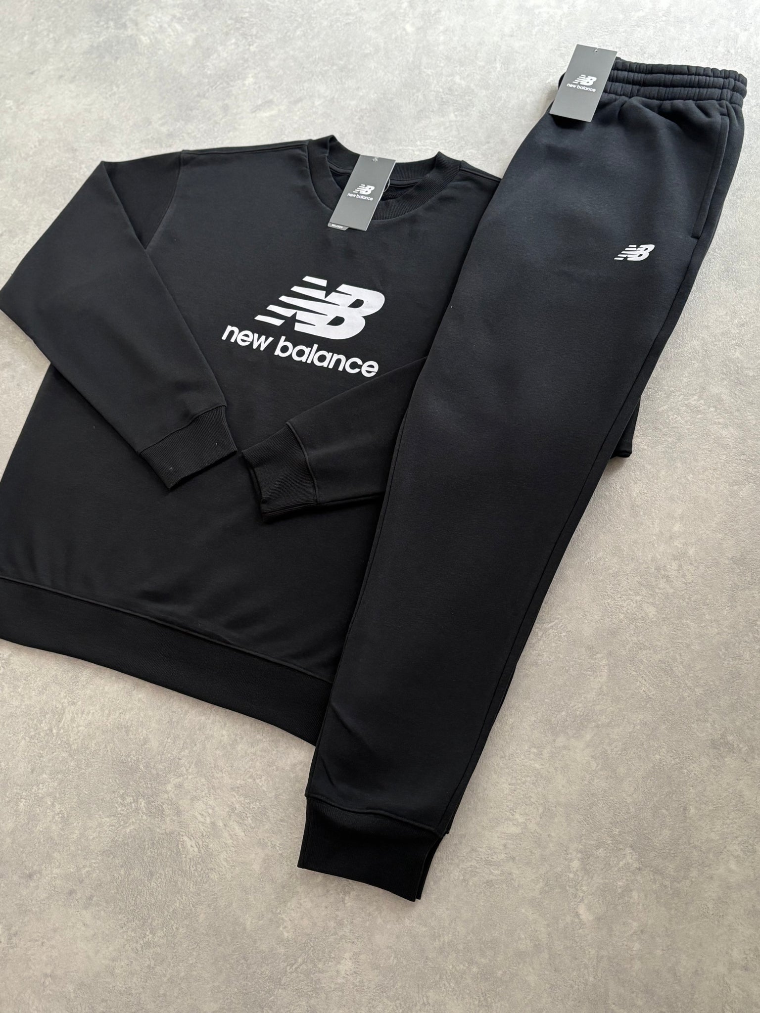 New Balance Fleece Trainingspak Zwart