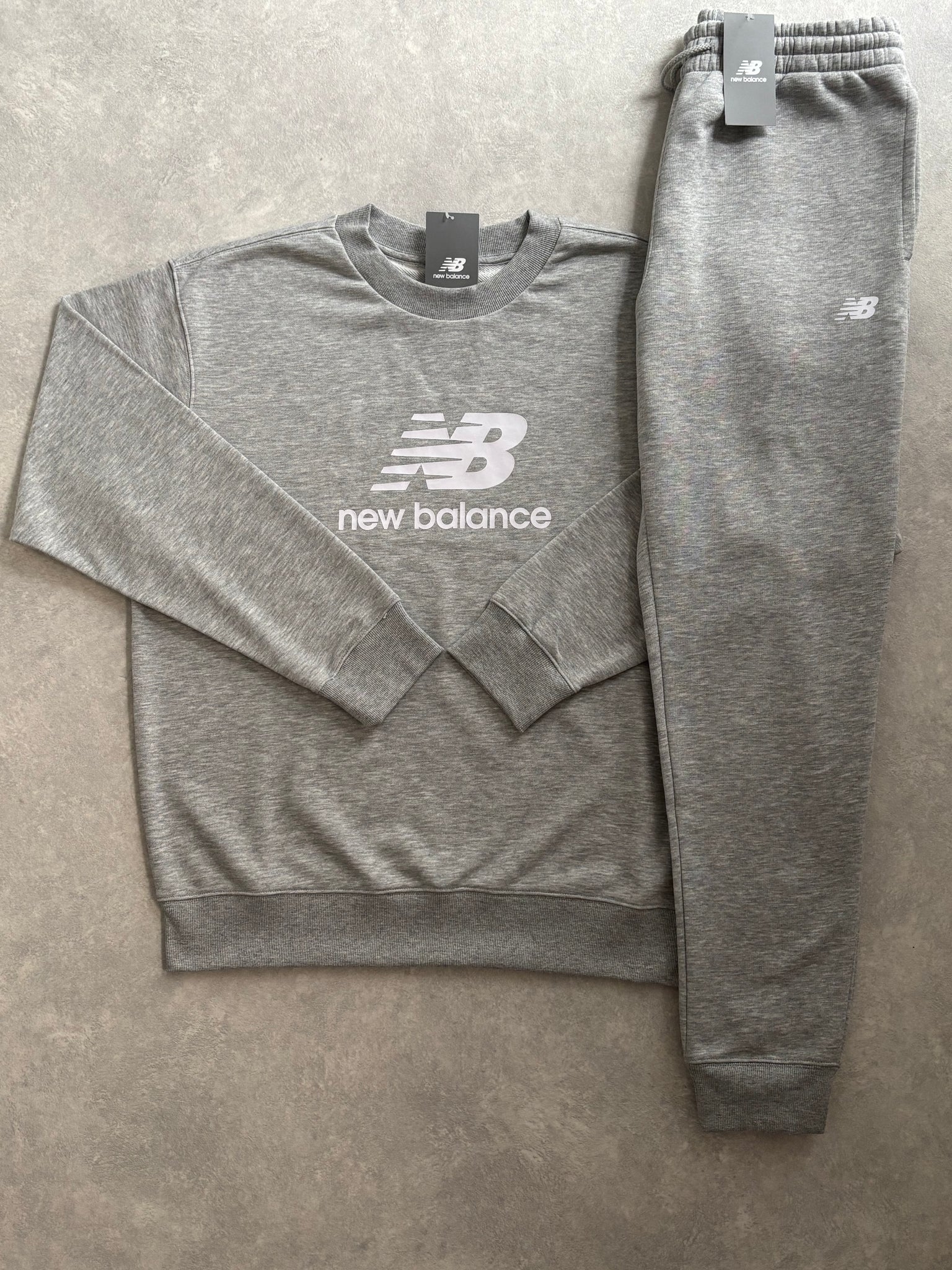 New Balance Fleece Trainingspak Grijs
