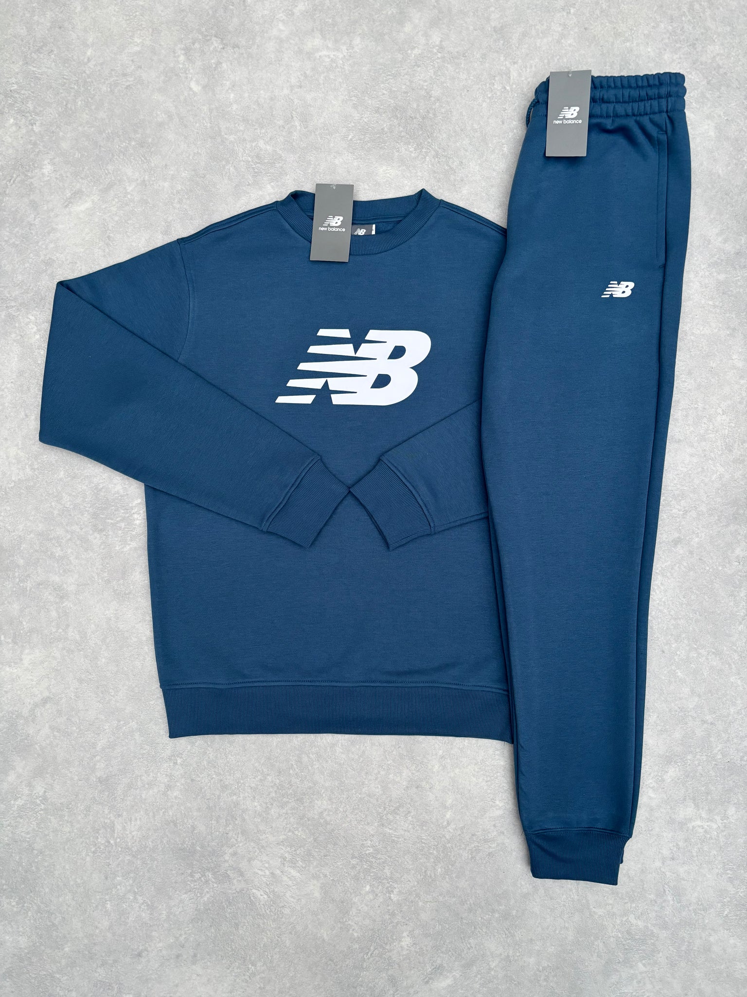 New Balance Fleece Trainingspak Blauw