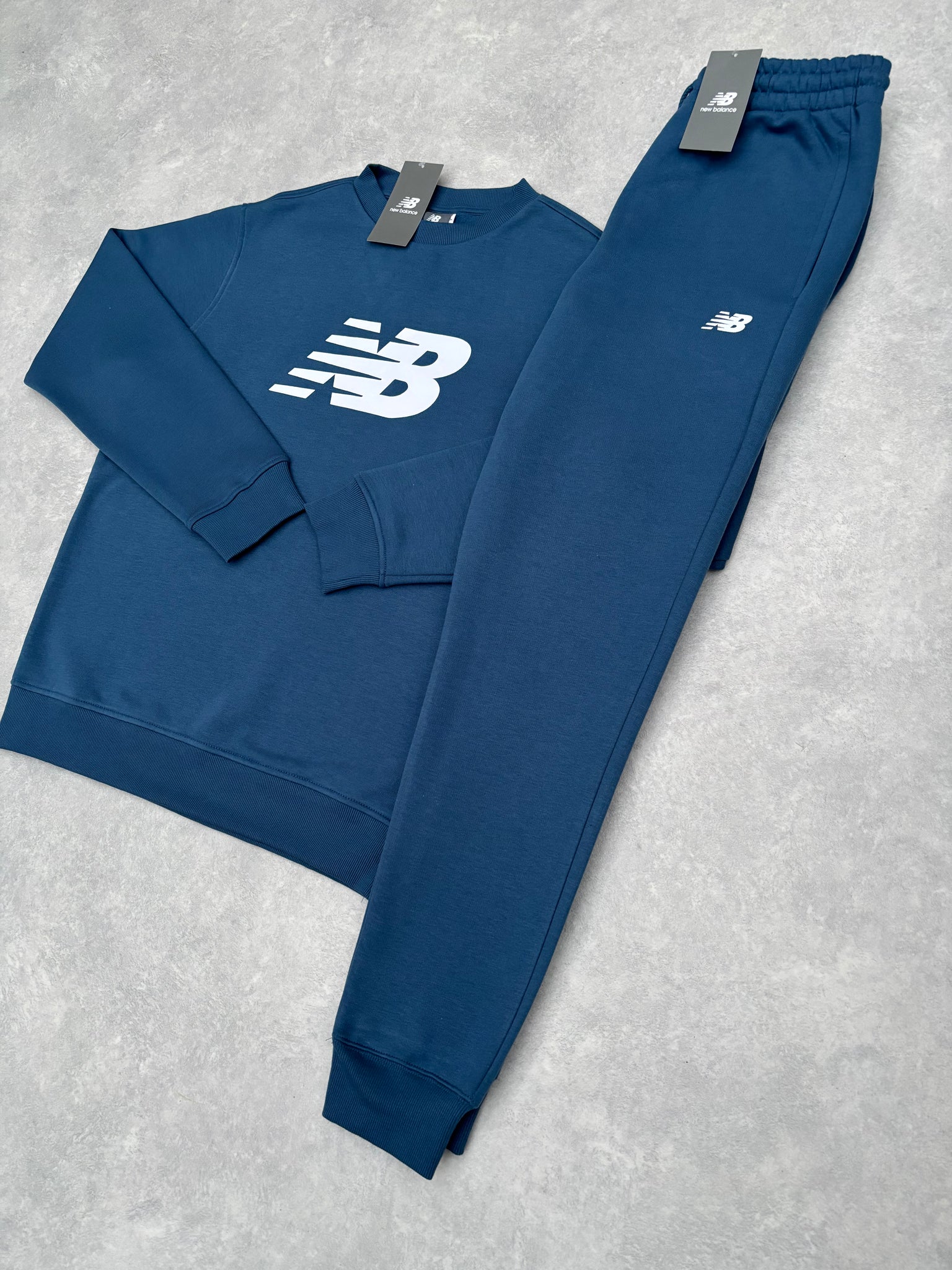 New Balance Fleece Trainingspak Blauw