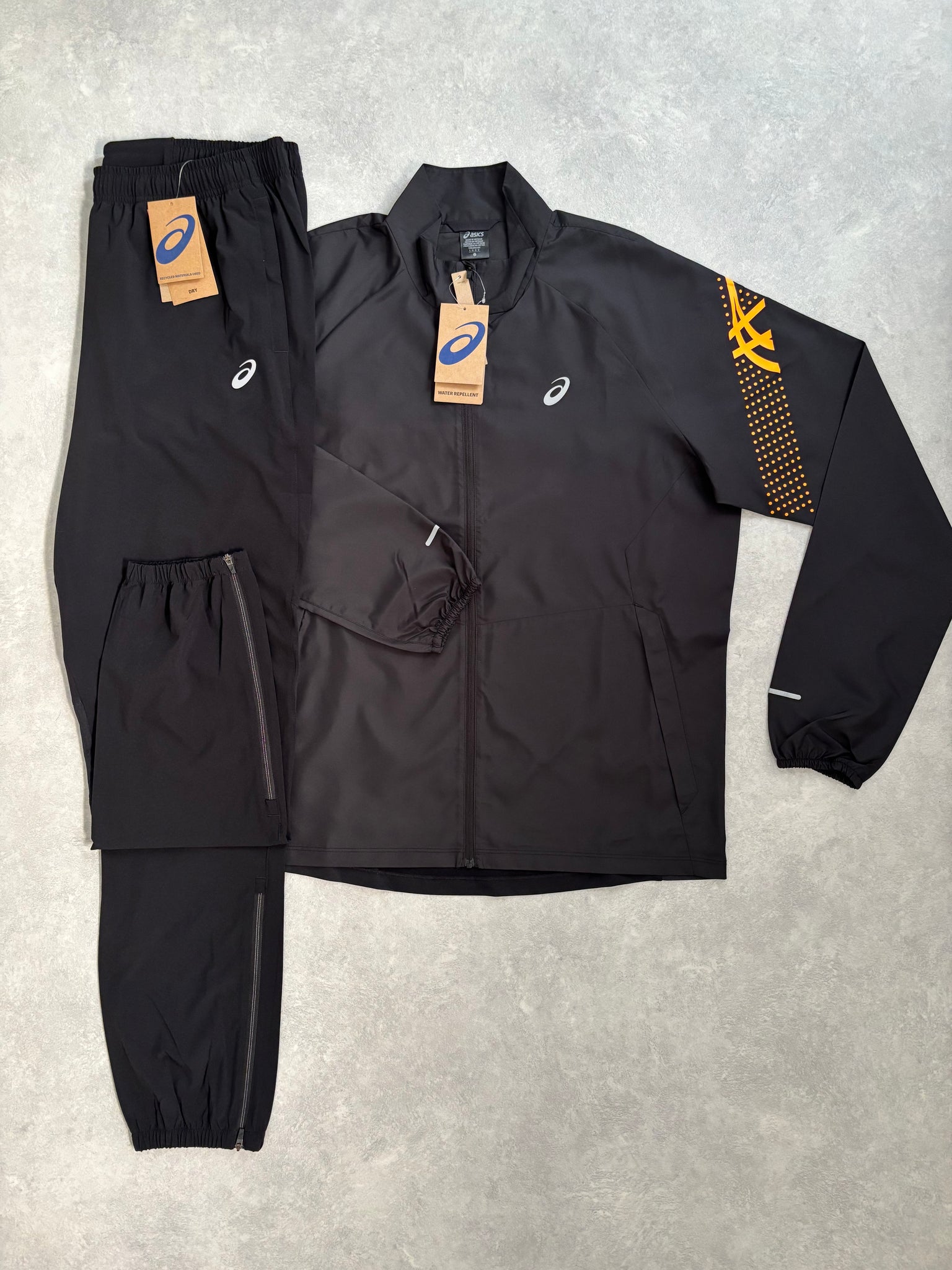 Asics Icon Trainingspak Zwart/Oranje