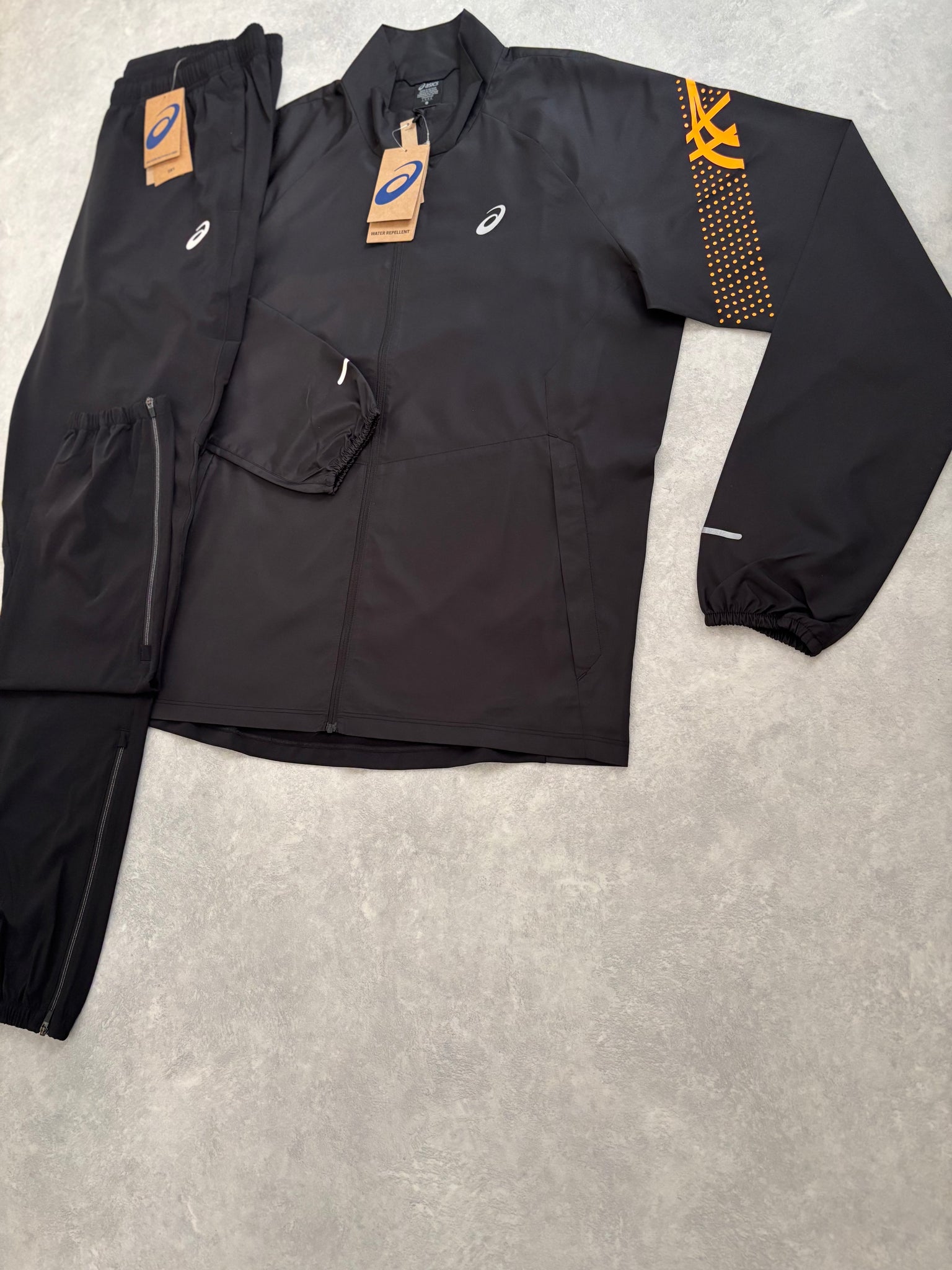 Asics Icon Trainingspak Zwart/Oranje